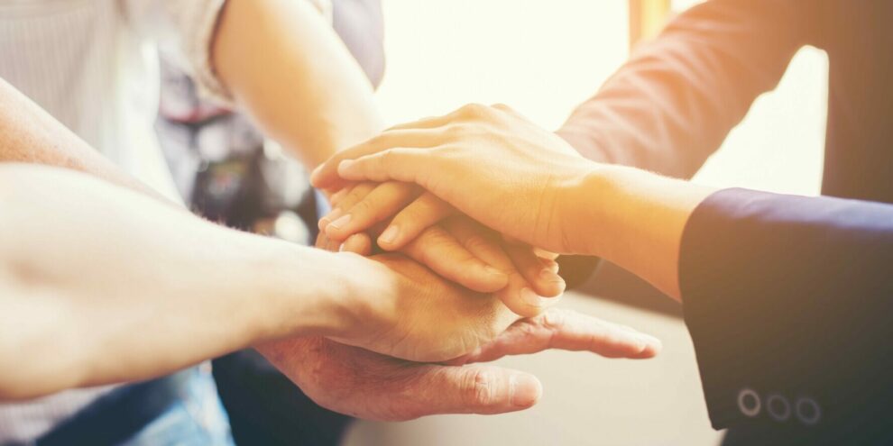 Concept of teamwork: Close-Up of hands business team showing un